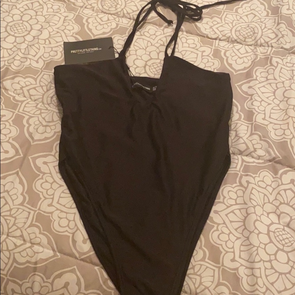 PrettyLittleThing black one piece.